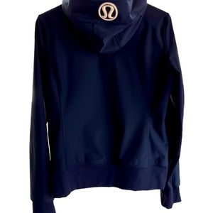 Lululemon jacket. Navy blue with white logo on hood.